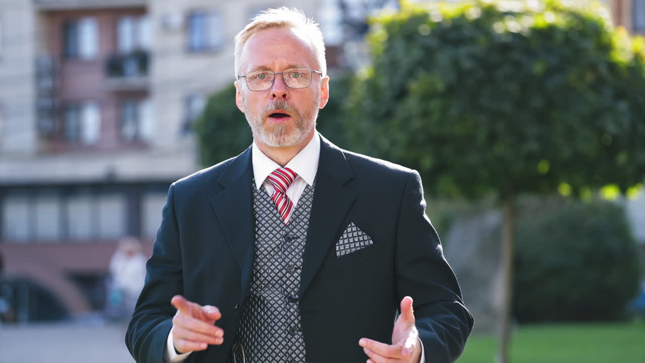 Man journalist on the job. Professional reporter portrait in the city answers the phone call