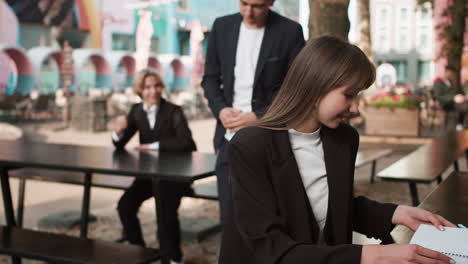 boy going to talk to girl outdoors