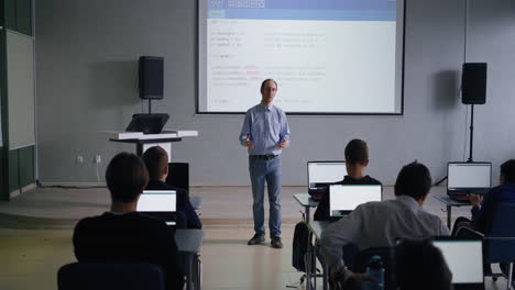 teacher leading a programming class