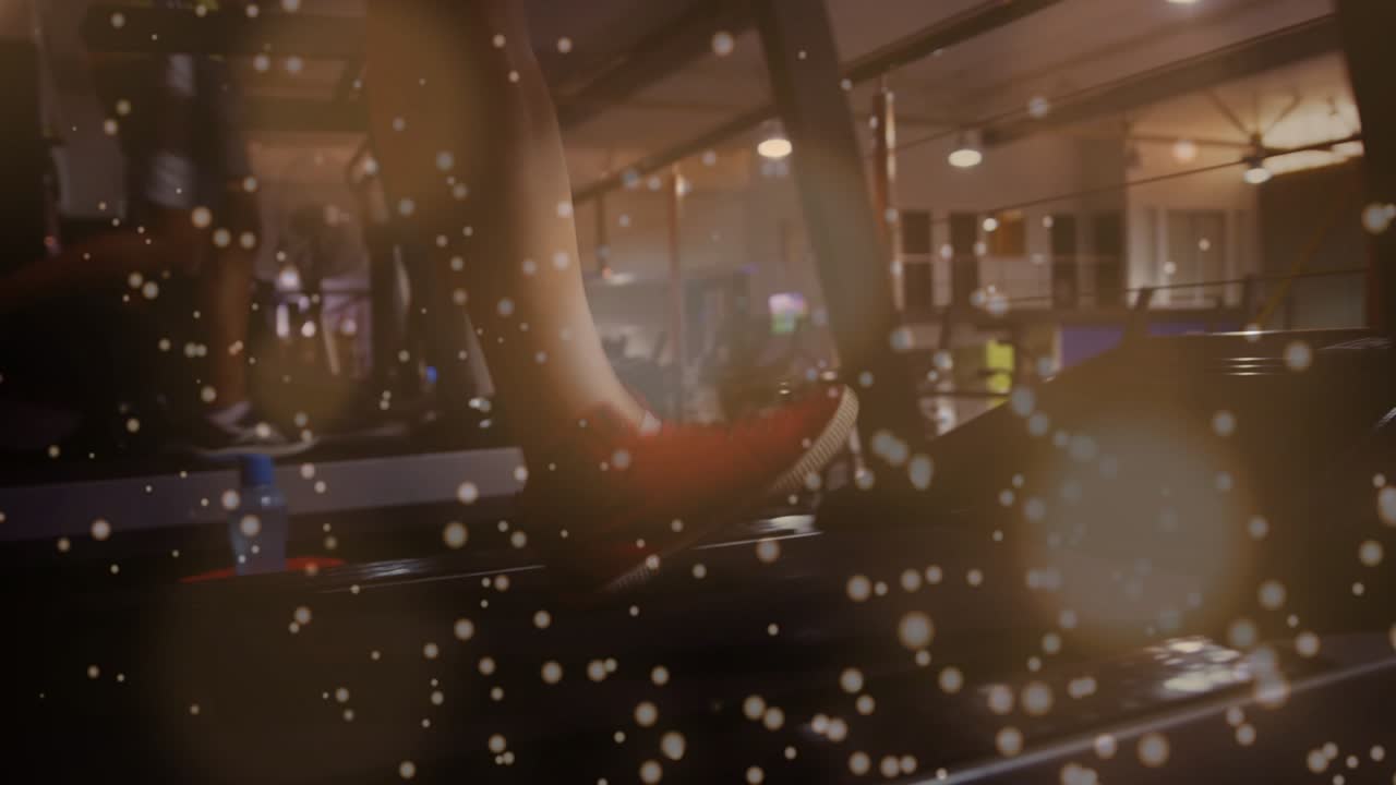 Man stepping onto treadmill, low camera slowly revealing legs while bokeh overlay enhancing cardio