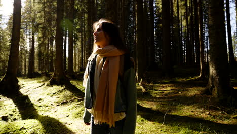 woman hiking in a sunny forest