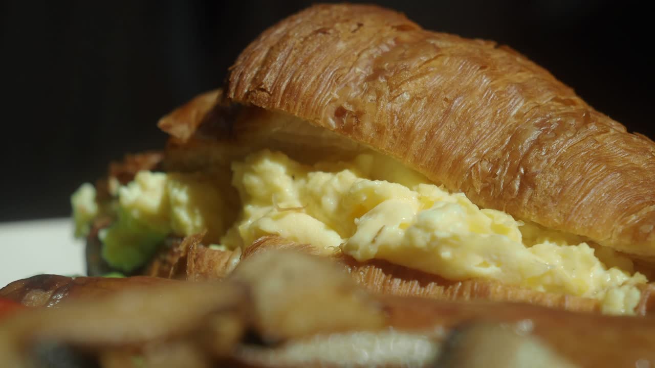 Croissant sandwich with scrambled eggs