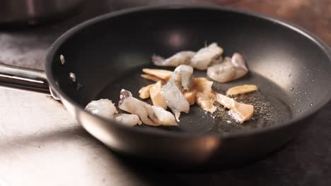 frying shrimp in a pan