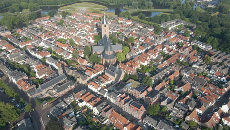 aerial view of large, classic church located in a small town center