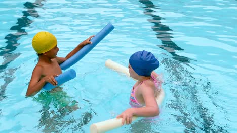 kids swimming with noodle floater