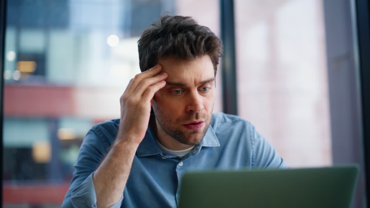 Frustrated ceo closing laptop worried mistake at office closeup. Stressed man