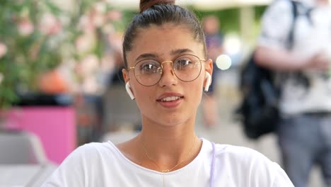 young woman in outdoor cafe setting