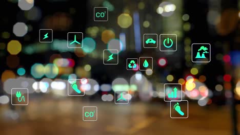 Animation-of-multiple-digital-icons-against-blurred-view-of-night-city-traffic