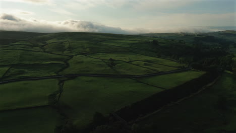 Establishing-Drone-Shot-Over-Hills-of-Yorkshire-Dales-on-Cloudy-Morning