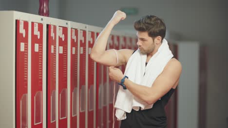 Handsome-narcissus-girthing-muscles-with-measuring-tape.