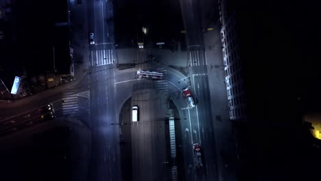 fire trucks crossing intersection in the night