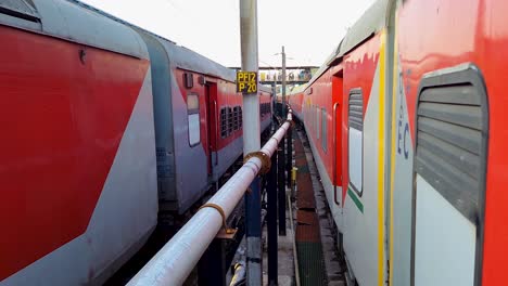 passenger-train-standing-on-track-crossing-each-other-from-opposite-direction-at-morning-video-is-taken-at-new-delhi-railway-station-on-Aug-04-2022