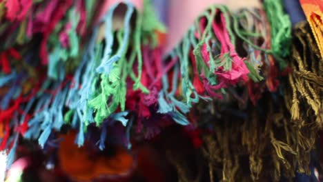 sliding shot of some colourful cloths in peru market