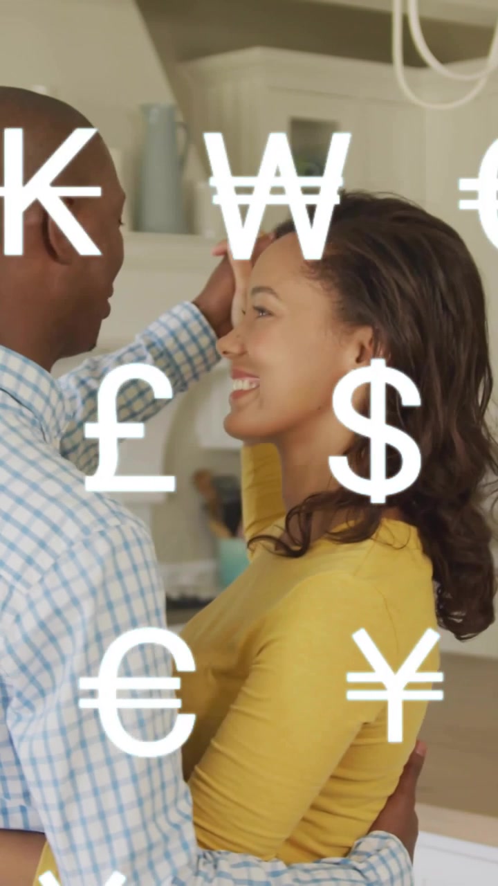 Currency symbols appearing, couple embracing, man tucking hair, swaying to show joint finances