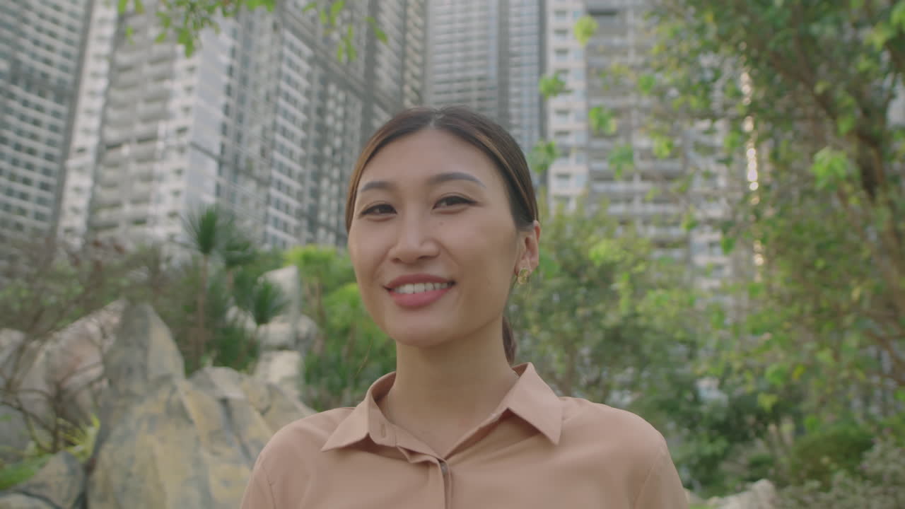 Beautiful Asian Woman Smiling on Camera Outdoors