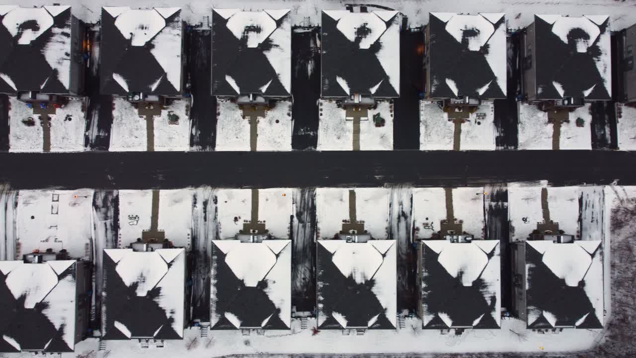 Suburban Cookie Cutter Homes covered in snow top-down aerial shot