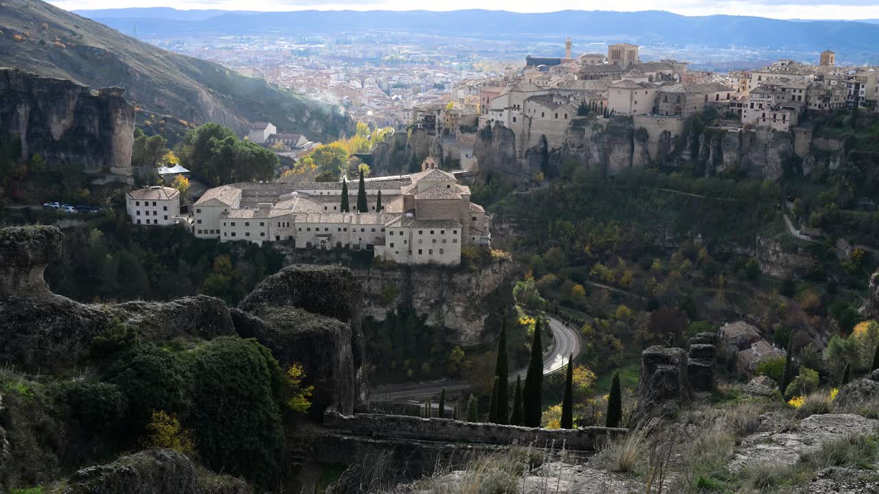 Across the deep gorge in Cuenca, Spain, the historic Convent of San Pablo faces the iconic Hanging Houses, presenting two distinct forms of UNESCO architecture.