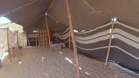 inside simple bedouin tent on desert, arabian camp