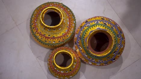 close-up of clay pots, beautifully decorated for an asian wedding