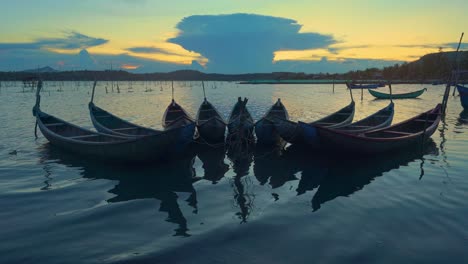 wooden boats on o loan lagoon in sunset - phu yen province, central vietnam