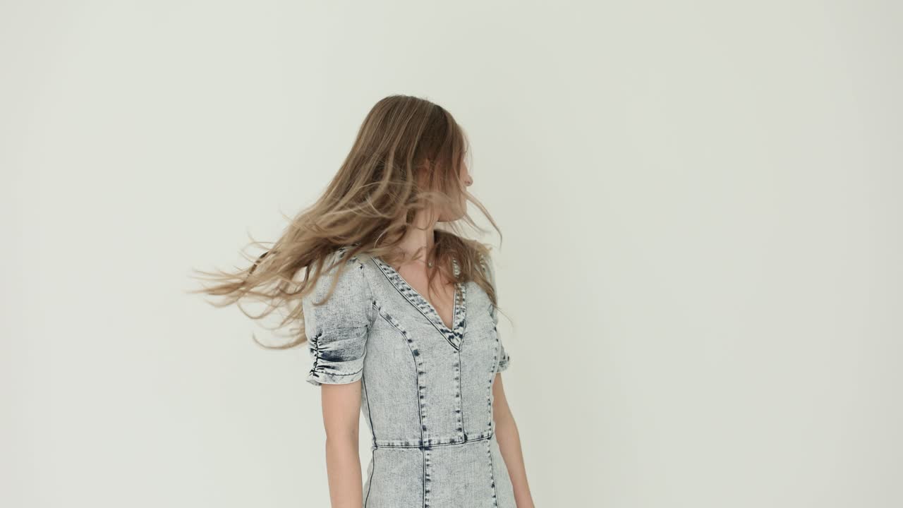 Woman with long hair in denim dress
