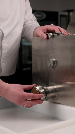 chef maintaining a pasta machine