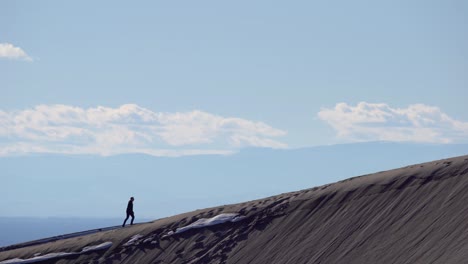 hiking over sand dunes on a sunny day