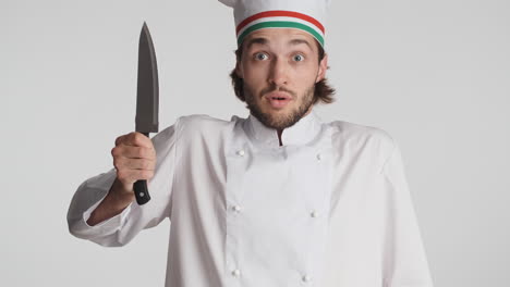 caucasian man in front of camera on white background.