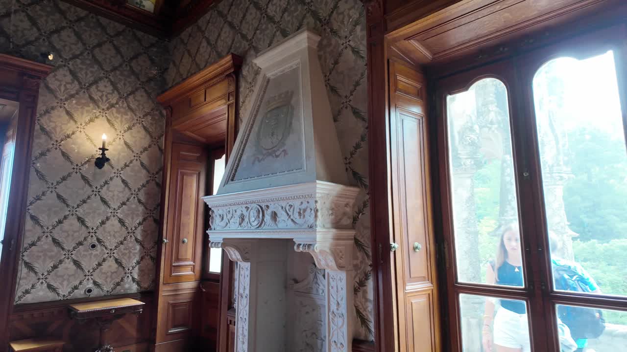 Ornate painted walls in a historic room inside Quinta da Regaleira, Sintra, Portugal