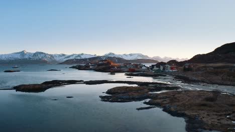the fiskenesholmen town outside of tromsø, norway.ascending aerial drone shot on a sunny winter day.