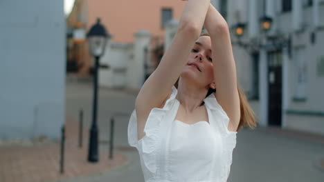 young woman posing outdoors in city