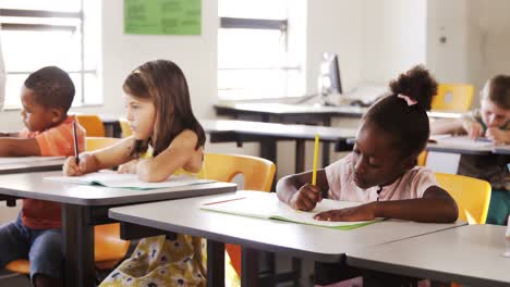 school kids studying in classroom