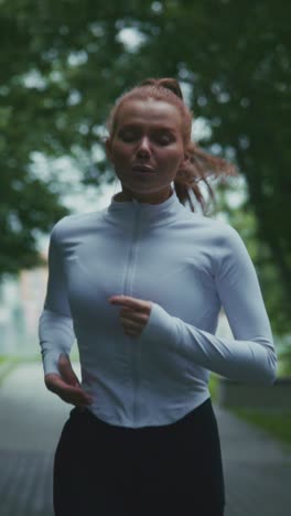 dynamic running journey: a woman embraces fitness, sweat, and nature, showcasing energy and determination in every stride