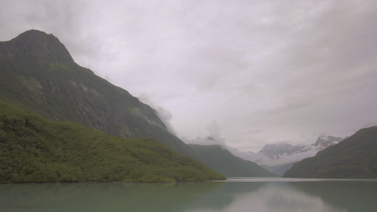 Alaskan Reservoir with Clouds Forming
