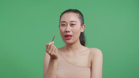 woman applying lipstick