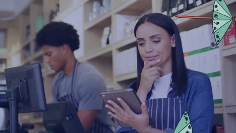 Animation-of-umbrellas-falling-over-biracial-waitress-using-tablet