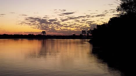 sunrise over the river with dam