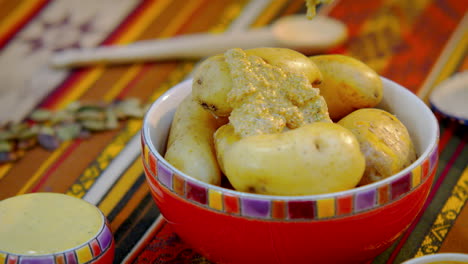 yellow cooked potatoes on a bowl