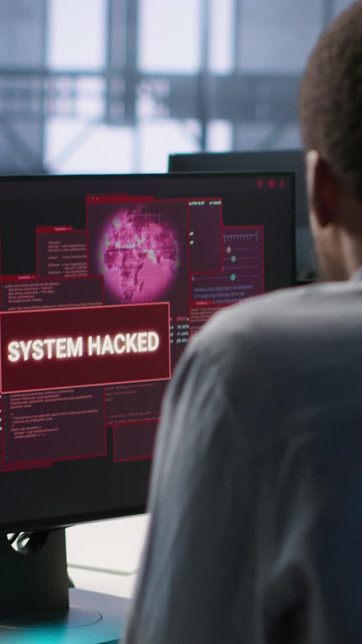 Vertical video Engineers seeing system hacked popup on PC screen in data center