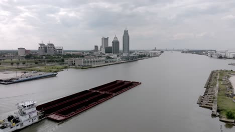 barge in mobile bay in mobile, alabama with drone video moving forward