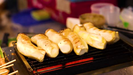 mushrooms grilling at khlong lat mayom market