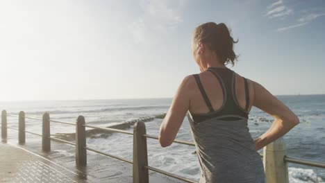 Senior-woman-running-on-a-promenade