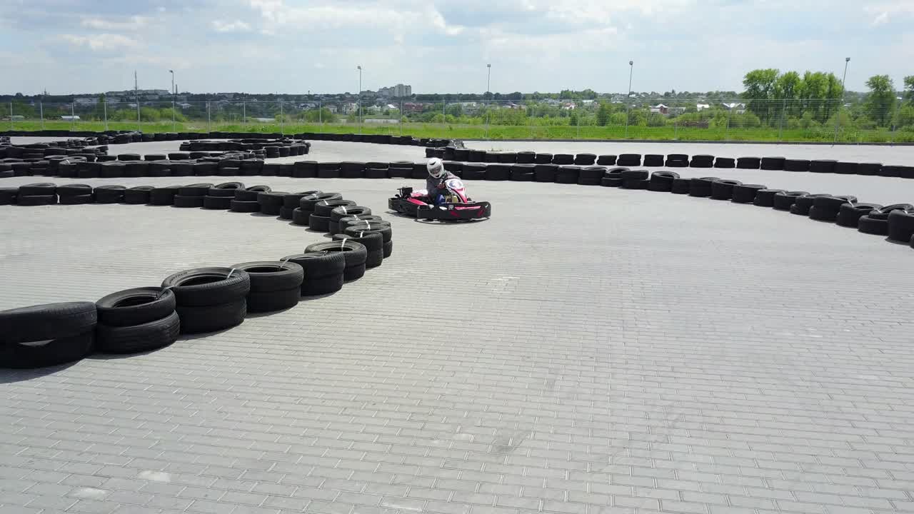 People Racing In Karts. VINNITSA, UKRAINE - MAY 2017: Europe Day, people driving karts on a kart track