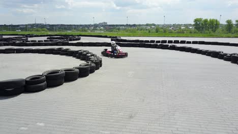 people racing in karts. vinnitsa, ukraine - may 2017: europe day, people driving karts on a kart track