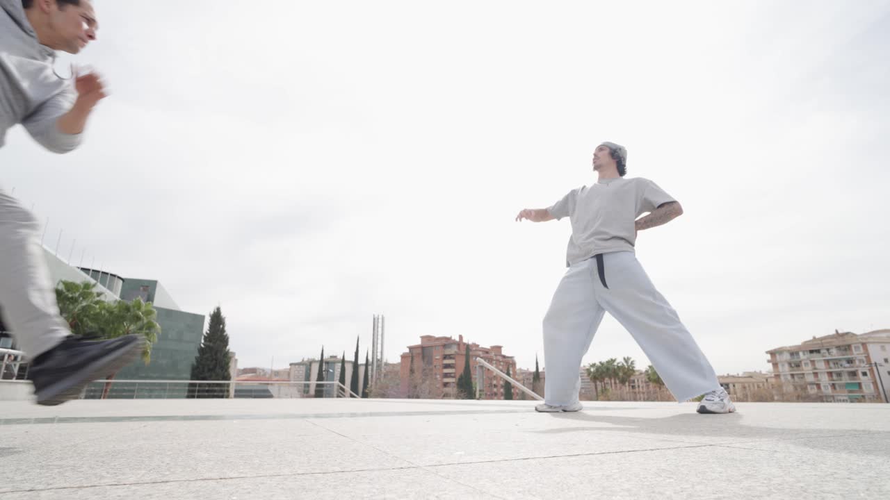 Breakdancers performing in urban environment