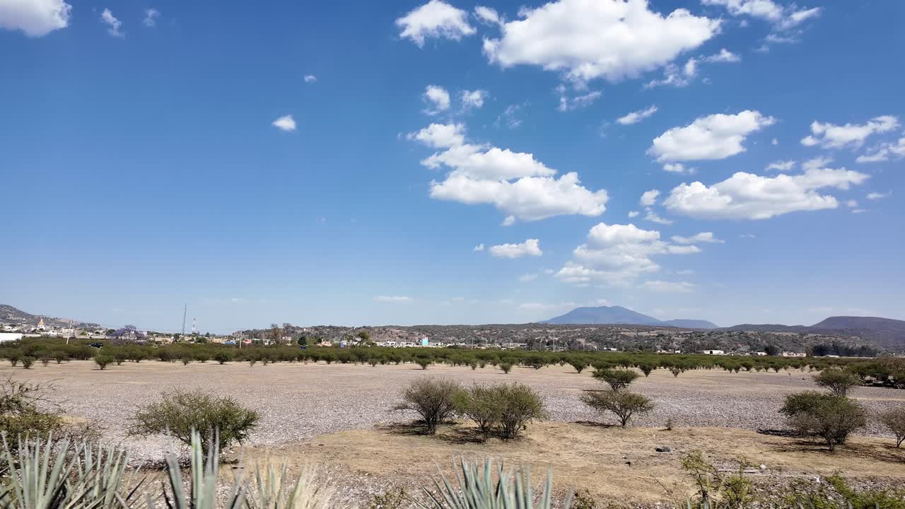 POV of driving through dry landscape of Amatitan famous for blue agave farming, Jalisco town