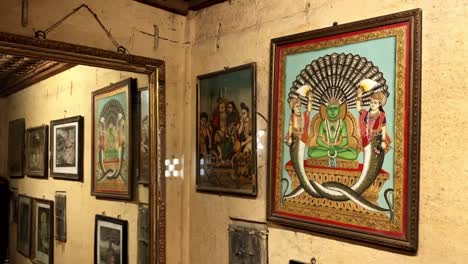 tilt down shot of interior view of the photo frames collection hanging on wall kothari's patwon ki haveli or patwa haveli jaisalmer india 4k