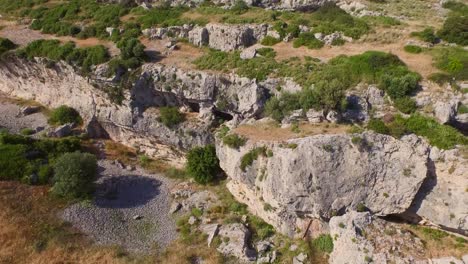 Aerial:-A-monastery-and-caves-in-the-mountains-of-Samos,-Greece