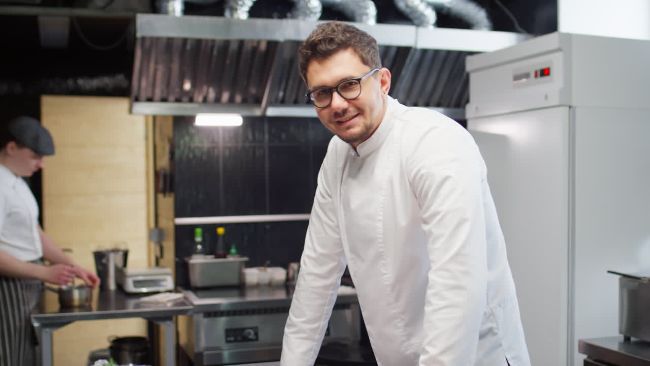 Portrait of Cheerful Chef in Restaurant Kitchen