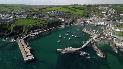 mevagissey village harbor in cornwall from an aerial drone shot, uk